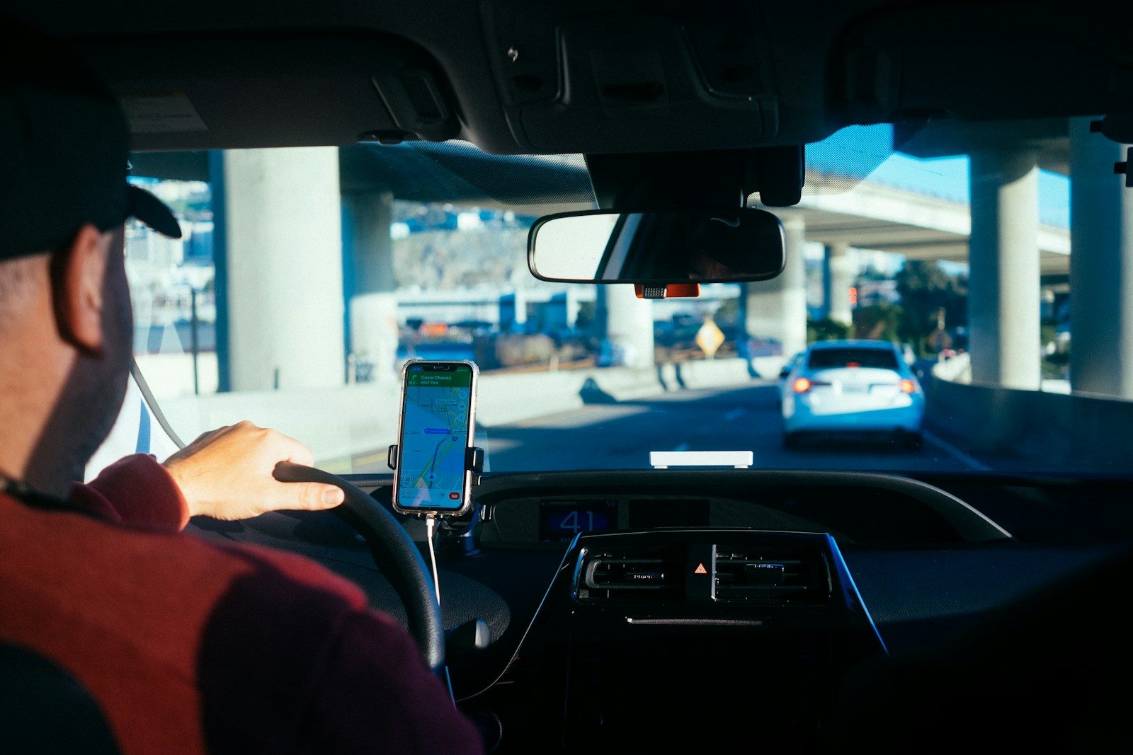 A driver logging hours on a cab-mounted screen